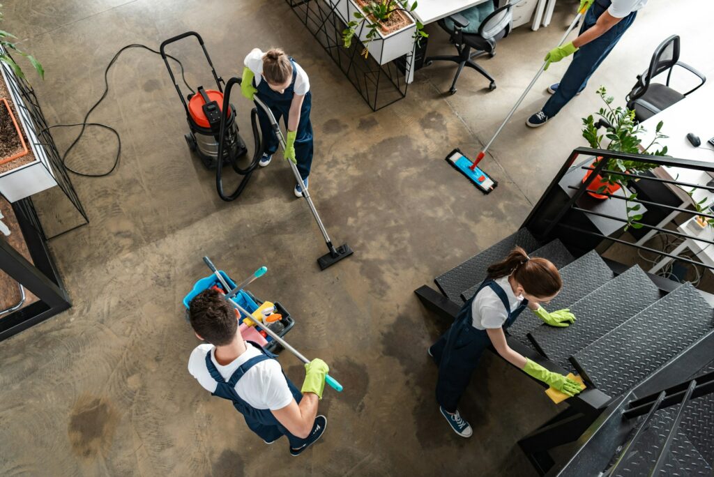 top view of cleaning company team cleaning modern office